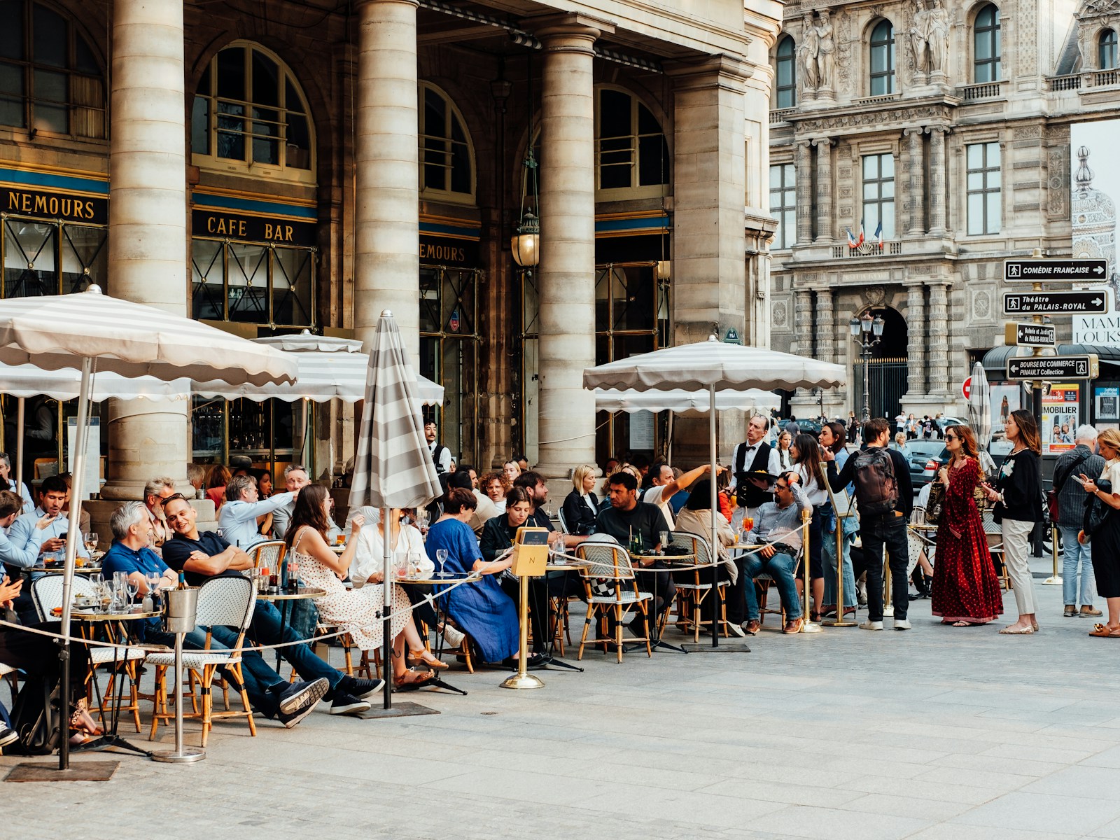 People enjoying an afternoon at a Paris cafe